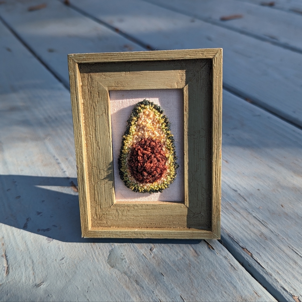 Cute avocado fiber art by Harp & Thistle Stitchery